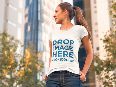 Clothing Mockup of a Woman in a T-Shirt Walking Around Town