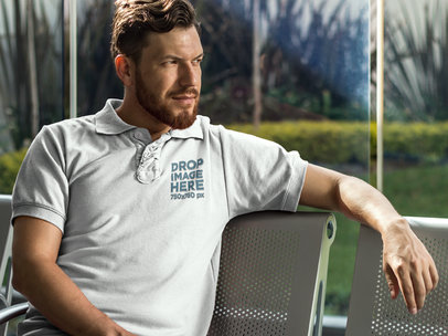 Collar Shirt Mockup Featuring a Man Sitting on a Bench