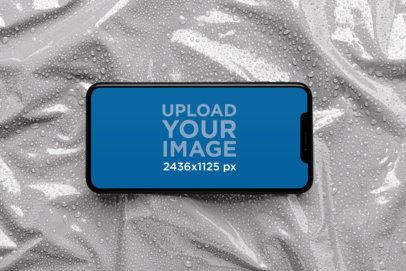 iPhone XS Mockup over a Wet Plastic Surface 25968