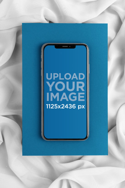 iPhone XS Max over a Cardboard Surrounded by Sheer Fabric 25960