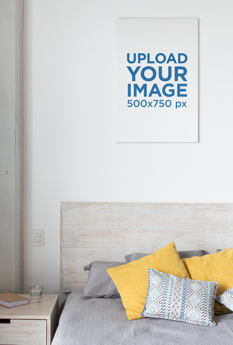 Mockup of a Vertical Canvas Hanging over a Tidy Bed