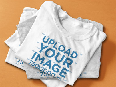 T-Shirt Mockup Featuring a Stack of Folded T-Shirts 6402a