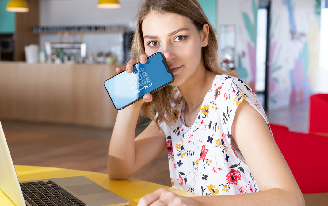 iPhone 11 Pro Mockup of a Blonde Woman in a Coworking Space 
