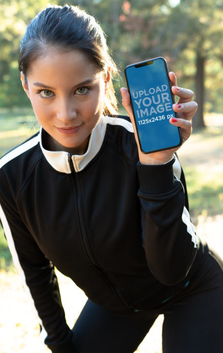 iPhone 11 Pro Mockup of a Woman Wearing Active Wear