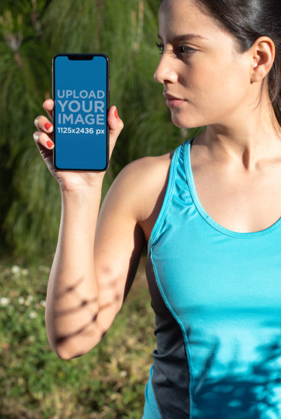 iPhone 11 Pro Max Mockup of a Sporty Woman Outdoors