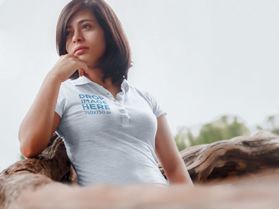 Polo Shirt Mockup of a Girl Standing Next to a Fallen Tree a6444