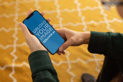 iPhone Mockup Featuring the Hands of a Man Using His iPhone X 25543