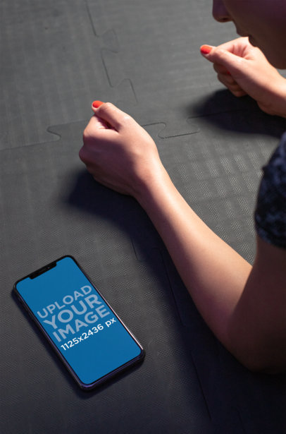 iPhone 11 Pro Mockup Featuring a Woman Doing a Plank