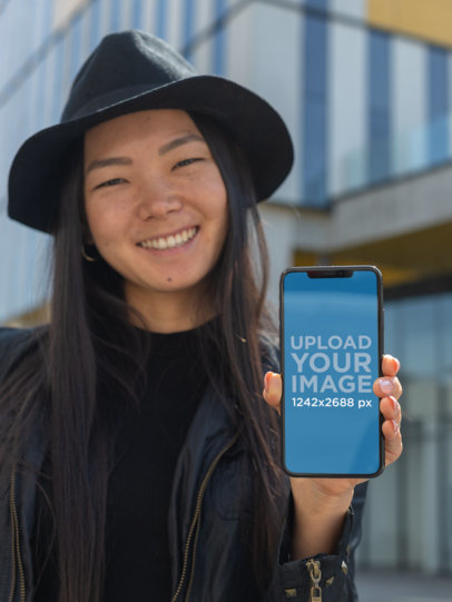 iPhone 11 Pro Max Mockup Featuring a Trendy Woman Showing off Her Screen 