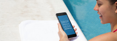 iPhone Mockup Featuring a Pretty Woman by the Pool 
