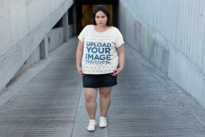 Plus Size Tee Mockup Featuring a Woman Walking over a Parking Ramp
