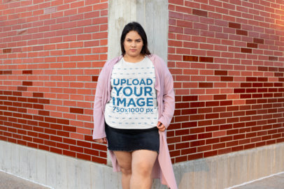 Plus Size T-Shirt Mockup of a Woman Standing in a Brick Wall Corner