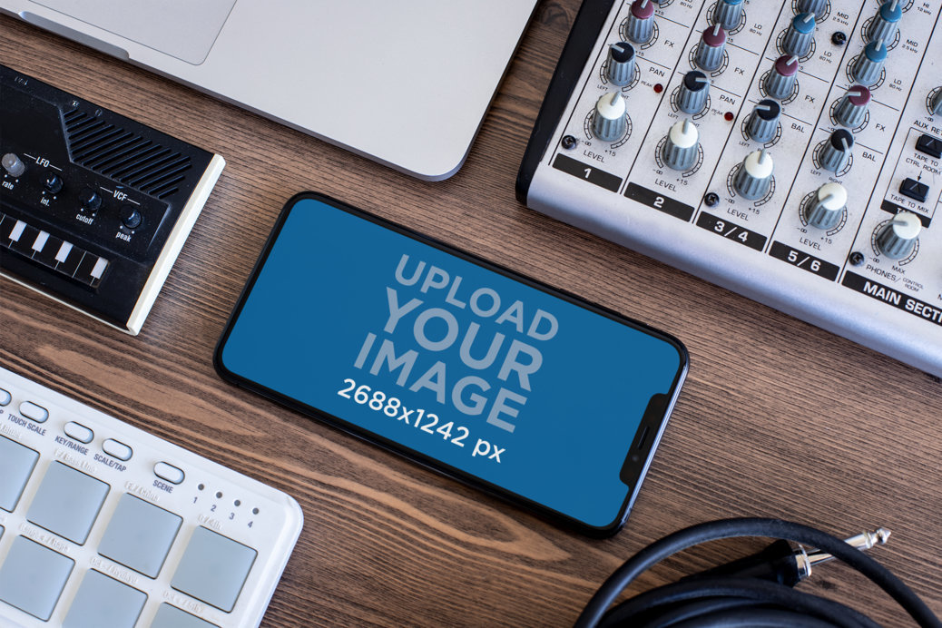 iPhone 11 Pro Max Mockup Featuring a Home Studio Console