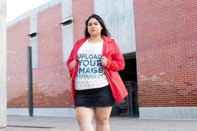 Plus Size Tee Mockup of a Bold Woman Posing by a Brick-Walled Bodega