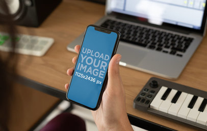 Mockup of an iPhone 11 Pro in a Home Studio