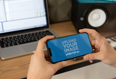 iPhone XS Mockup Featuring a Home Music Studio 25755