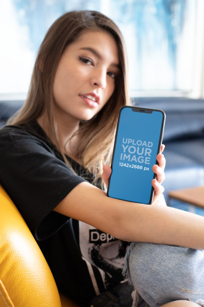 Mockup of a Cute Blonde Woman Resting an iPhone 11 Pro Max over Her Arm