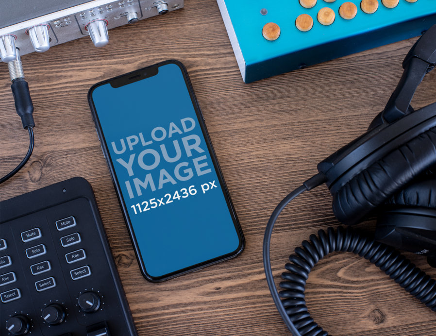 iPhone 11 Pro Mockup Surrounded by Audio Devices
