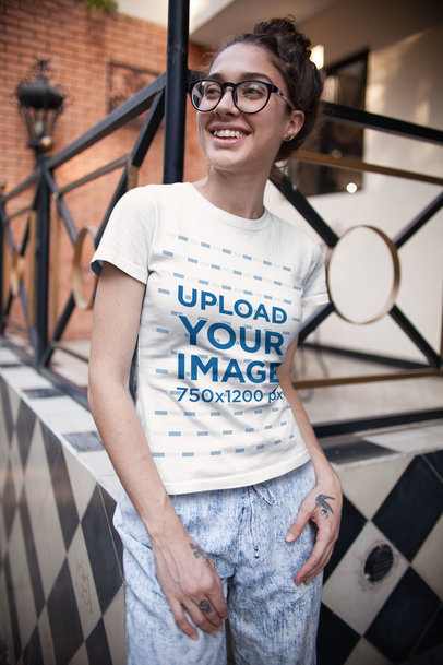 T-Shirt Mockup of a Curly-Haired Woman with Glasses 
