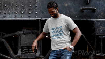 T-Shirt Video of a Man Posing Next to a Locomotive 12780