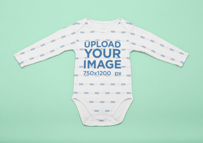 Mockup of a Onesie Laid Flat on a Surface
