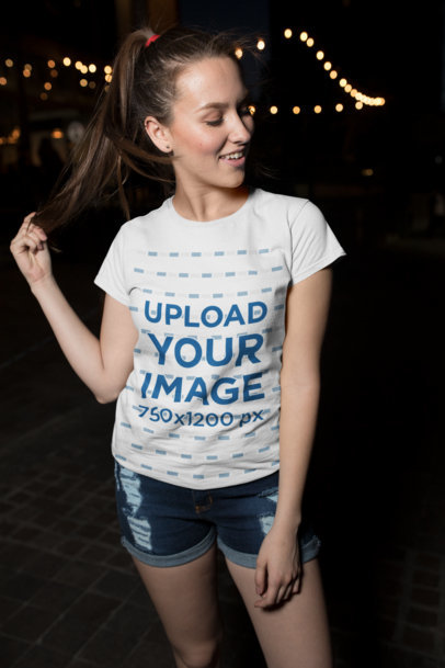T-Shirt Mockup  Featuring a Pretty Woman in a Casual Outfit Having Fun at Night