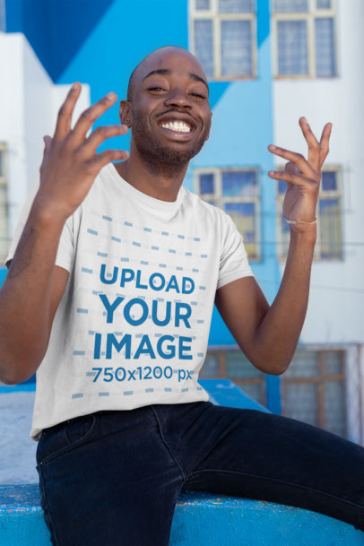 T-Shirt Mockup of a Man Smiling with a Cool Pose