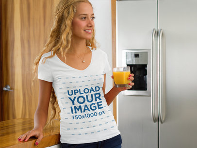 T-Shirt Mockup of a Woman Having a Glass of Orange Juice a7793