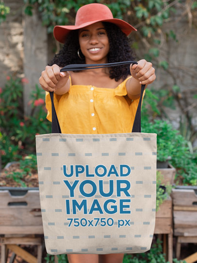 Mockup of a Good-Looking Woman in a Summer Look Holding a Tote Bag