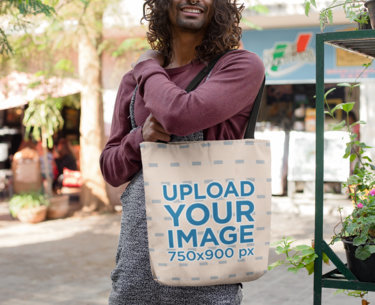 Tote Bag Mockup of a Trendy Man with Long Hair in the Street 26702