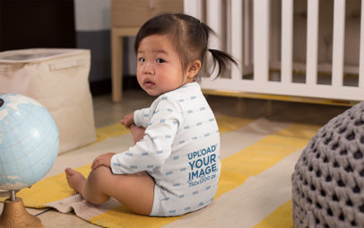 Onesie Mockup Featuring a Baby Girl by a Crib 25136