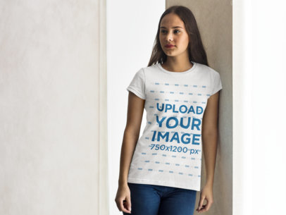 T-Shirt Mockup of a Beautiful Woman Leaning on a Wall
