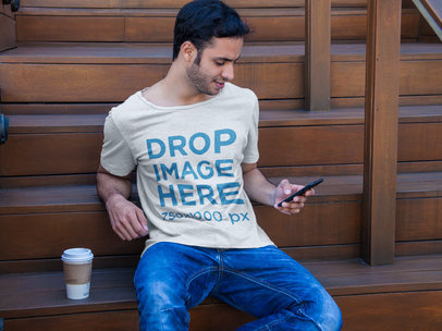 T-Shirt Mockup of a Man Sitting on a Staircase 