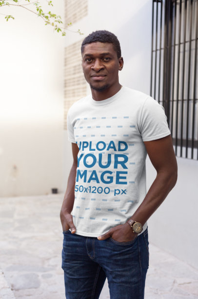 T-Shirt Mockup of a Cool Man Standing Casually with His Hands in His Pockets