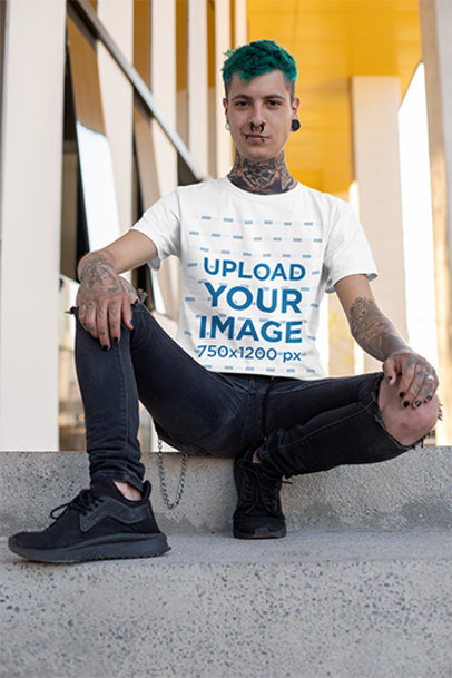 Mockup of a Punk Man with Blue Hair and Tattooed Arms Wearing a T-Shirt