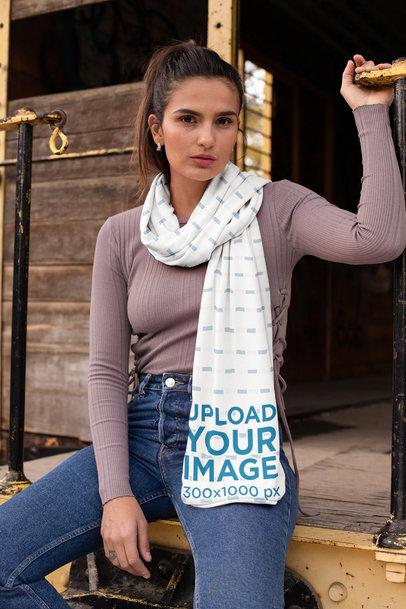 Scarf Mockup Featuring a Girl Sitting on the Edge of an Abandoned Wagon 25671