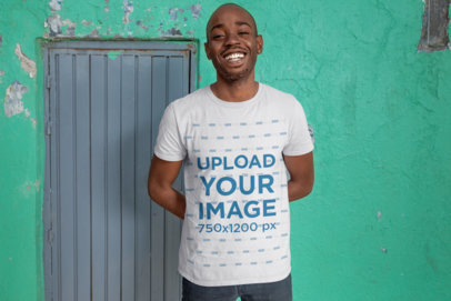 T-Shirt Mockup of a Friendly-Looking Man in an Urban Area 