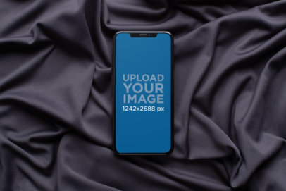 Mockup of a Space Gray iPhone XS Max on a Silk Surface 25969