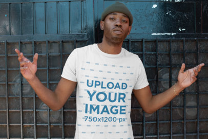 T-Shirt Mockup of a Serious-Faced Man with a Beanie Opening His Arms