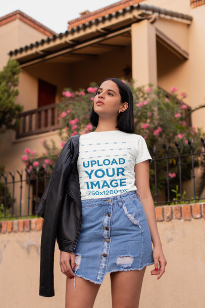 Tee Mockup of a Short-Haired Woman in Front of a House Facade