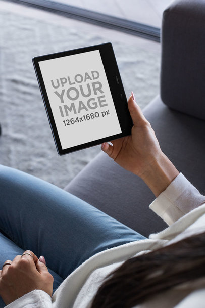 Mockup Featuring the Hands of a Woman Holding a Kindle Oasis 26025