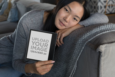 Kindle Oasis Mockup of a Woman Resting on a Couch 