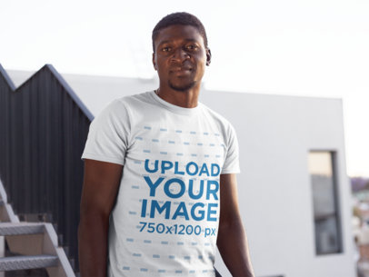 Mockup of a Man with Short Hair Wearing a T-Shirt in an Urban Scenario