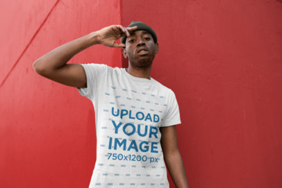 T-Shirt Mockup of a Man with a Beanie Making a Salute Sign