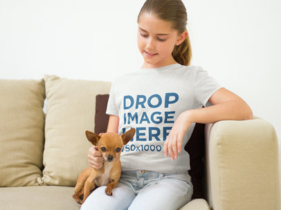 T-Shirt Mockup of a Young Girl with her Dog at Home