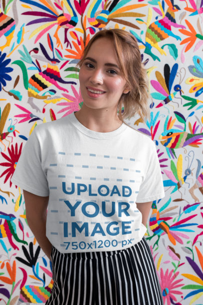 T-Shirt Mockup of a Pretty Woman Smiling in front of a Colorful Background 