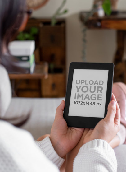 Kindle Paperwhite Mockup of a Woman Relaxing in Her Living Room