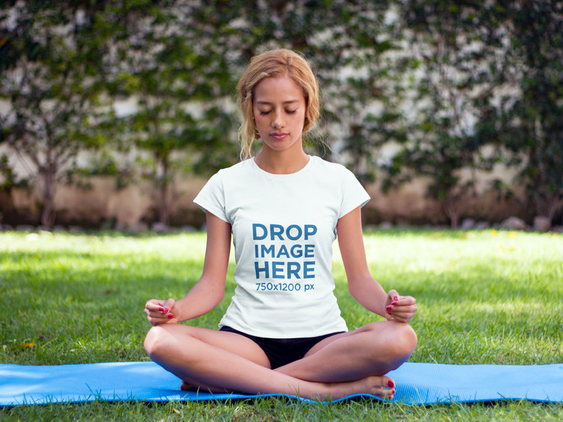 T-Shirt Mockup of a Woman Practicing Yoga at a Park