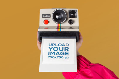 Polaroid Picture Frame Mockup Featuring an Arm Holding a Retro Camera 26160