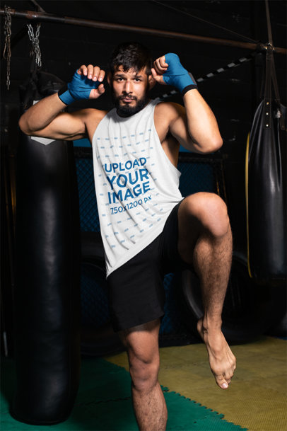 Sleeveless Shirt Mockup of an MMA Wrestler on a Fighting Pose Inside an Octagon